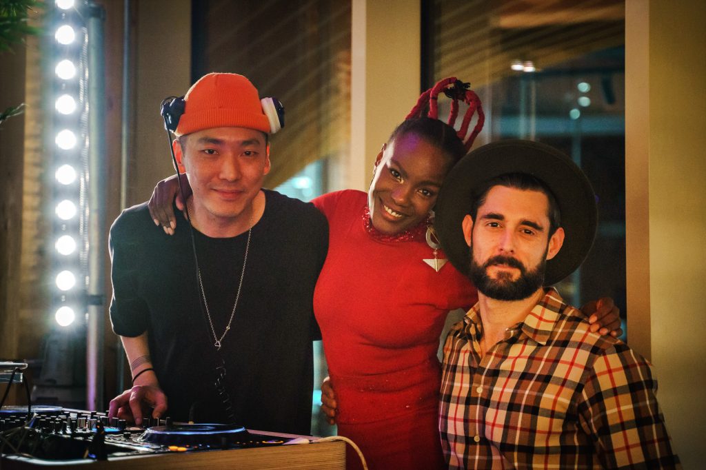 Logan Schmitz with singer Shingai and DJ Kotto at a London event